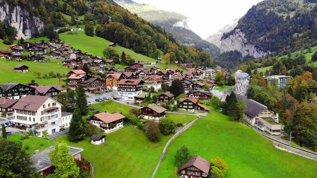 Aerial view over the village of Lauterbrunnen in Switzerlandwith its famous waterfall - drone footage