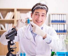 The male doctor working in the lab on virus vaccine