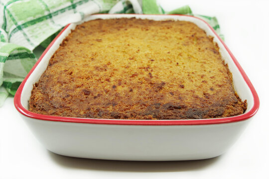 Kugelis or baked potato pudding made from grated potatoes, eggs, onion, bacon and milk. Traditional Lithuanian cuisine