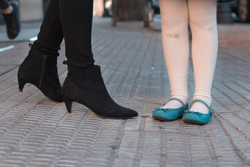 Human feet of woman and girl