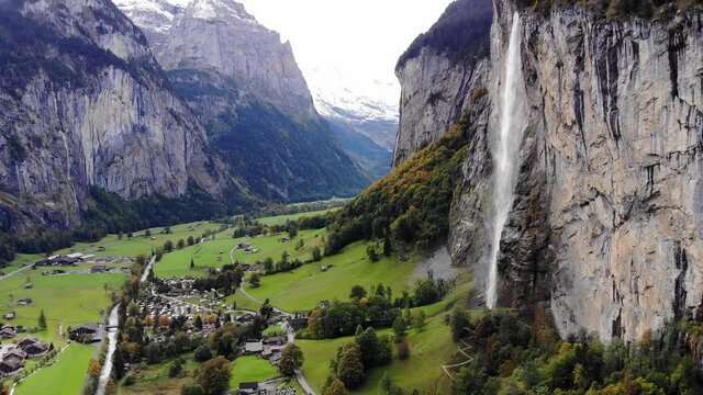 Aerial view over the village of Lauterbrunnen in Switzerlandwith its famous waterfall - drone footage