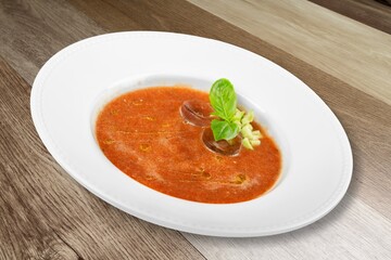 Bowl of delicious vegetable soup on a table