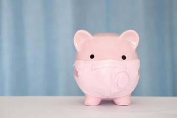 Piggy piggy bank wearing a mask