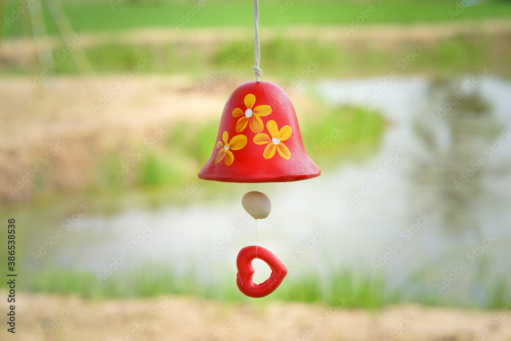 Canvas Prints red ceramic bells hanging on a string