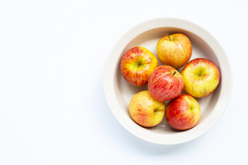 Fresh and juicy apples in bowl on white