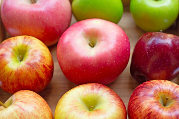 Fresh and juicy apples on wooden box