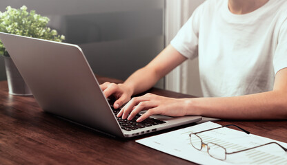 Fototapeta premium Businesswoman hands using laptop computer with the press keyboard at office.
