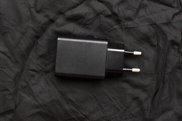black smartphone charger on black background
