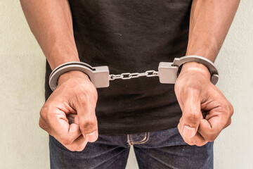 Concept human trafficking, hand young man in shackle. background look old or vintage style. (...