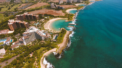 Aerial Ko Olina Resort, West Oahu coastline, Hawaii.  Aulani, a Disney Resort & Spa,  The Four Seasons Resort O'ahu at Ko Olina.  natural and man-made lagoons with white sand beaches - obrazy, fototapety, plakaty