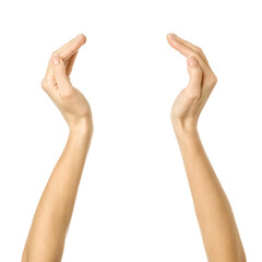 Holding or measuring hands. Woman hand gesturing isolated on white