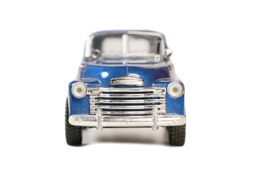 Blue toy retro car model on a white background. Isolated .