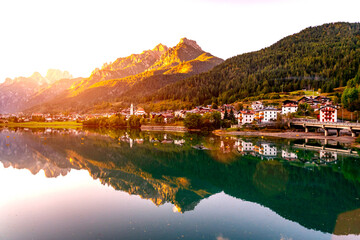 Fototapeta premium A small town on a mountain lake. Alps, Austria.
