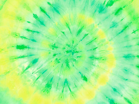 Spiral tie dye pattern print background wallpaper in lime green yellow.