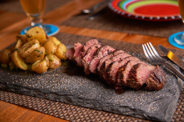 Grilled sliced beef angus with baked potatoes