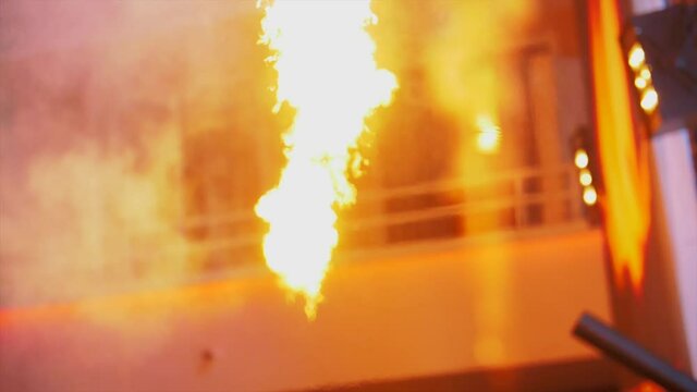 Fire shooting upwards during a festival at night - Slow-motion party footage - Pyrotechnics