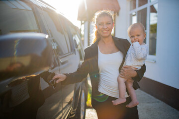 Beautiful business woman mother in a suit with a small child