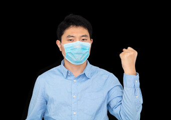 Man wearing mask making fists in front of black background