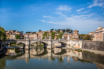 Fototapeta na wymiar The banks of the river Tiber and Ponte Vittorio Emanuele in Rome. Lazio, Italy