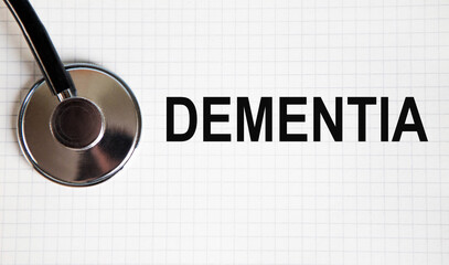 on the business card text DEMENTIA, next to the stethoscope.