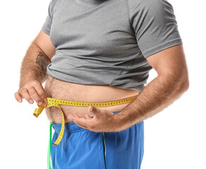 Overweight man with measuring tape on white background. Weight loss concept