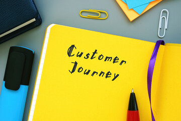 Business concept about Customer Journey with sign on the piece of paper.