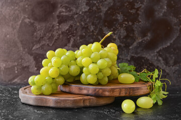 Ripe green grapes on table