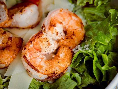 High resolution macro with close up grilled shrimp and lettuce 