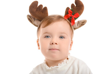 Cute little baby with Christmas deer horns on white background