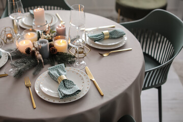 Beautiful table setting with Christmas decor in living room