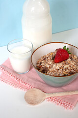 Healthy fast breakfast, oat meal with milk and strawberry. Morning food. Tasty