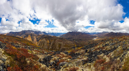 Fototapeta premium View of Scenic Mountains and Landscape on a Cloudy Day in Canadian Nature. Aerial Shot. Taken in Tombstone Territorial Park, Yukon, Canada.
