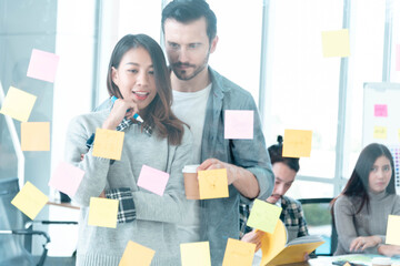Brainstorming diversity creative design use post it sticky note  team meeting with startup...