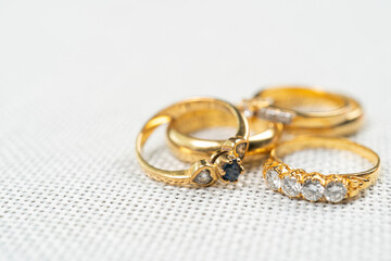 Group of diamond ring on white sack background.