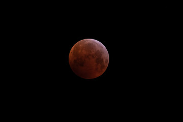 Lunar Eclipse 21.1.2019 with blood moon. Big moon in its full phase with detailed craters visible on its edges.