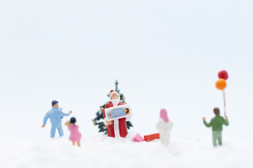 Miniature people, Santa claus and gifts for kid , Christmas and Happy New Year concept.