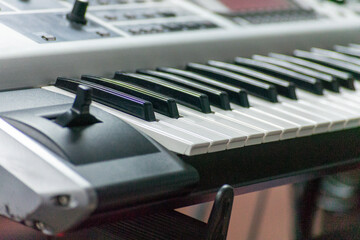 closeup of piano keys with bokeh effect