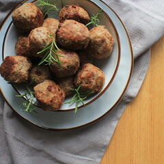 Roasted meatballs , delicious meat cutlets on wooden table . Top view .