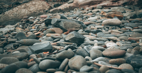 Abstract smooth round stones on the sea