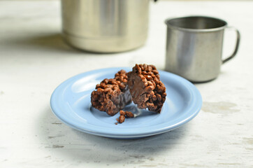 Chocolate bar on a plate with coffee