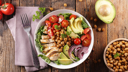 buddhah bowl- vegetable salad with chicken, chickpea, avocado and tomato