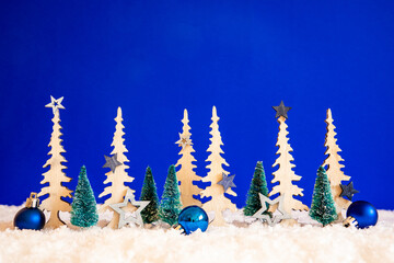 Christmas Trees With Copy Space. Christmas Decoration Like Blue Star Ornament And Balls. Blue Background With Snow.