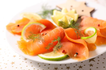 smoked salmon slices with lemon and dill