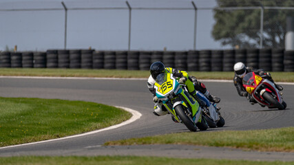 A shot of a racing bike cornering on a track.