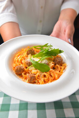 Healthy spaghetti dinner. Traditional Italian pasta with meatballs and cheese. Italian cuisine concept.