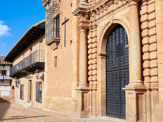Fototapeta premium Detailed view of the Santo Cristo church and the plaza mayor main square of the town of San Carlos del Valle, Ciudad Real province, Castilla la Mancha, Spain