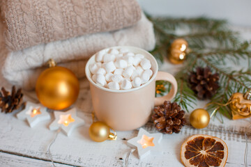 Fototapeta na wymiar Christmas background, coffee mug and marshmallows , Golden Christmas tree toys . Merry Christmas greeting card