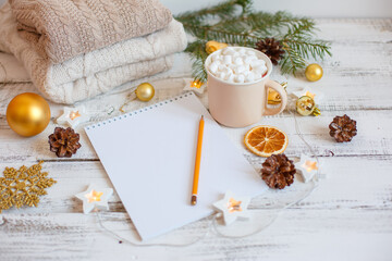 Christmas background, Notepad with pencil, coffee mug and marshmallows , Golden Christmas tree toys . Letter To Santa Claus. Merry Christmas greeting card