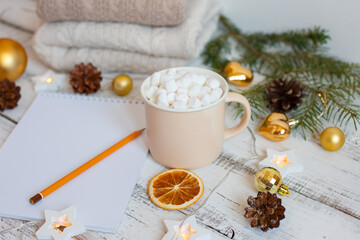 Christmas background, Notepad with pencil, coffee mug and marshmallows , Golden Christmas tree toys . Letter To Santa Claus. Merry Christmas greeting card