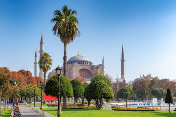 Fototapeta na wymiar Panoramic view of Hagia Sophia in sunny autumn day from fountain in Sultanahmet Park in Istanbul, Turkey
